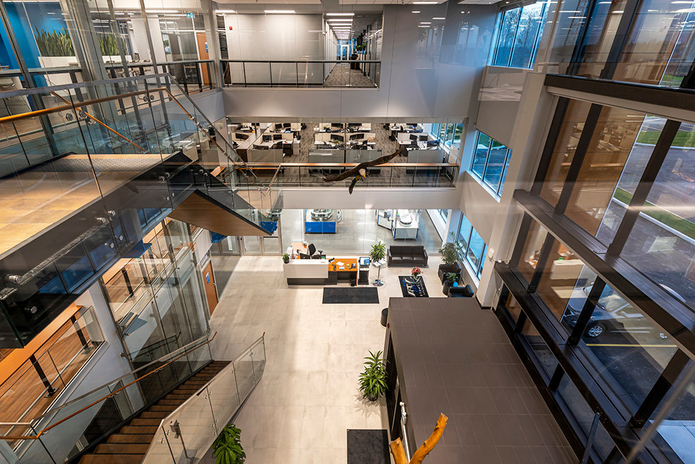 Image of front lobby looking down at a staircase and offices