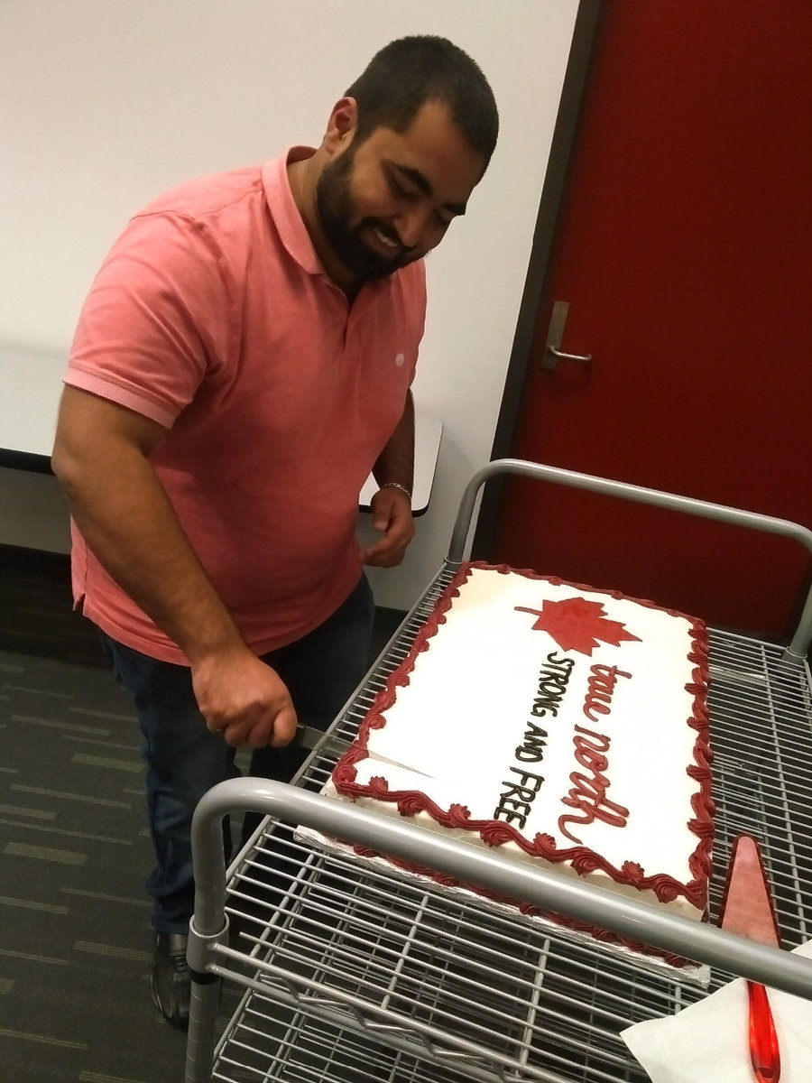 Rushin cuts his cake celebrating permanent residency